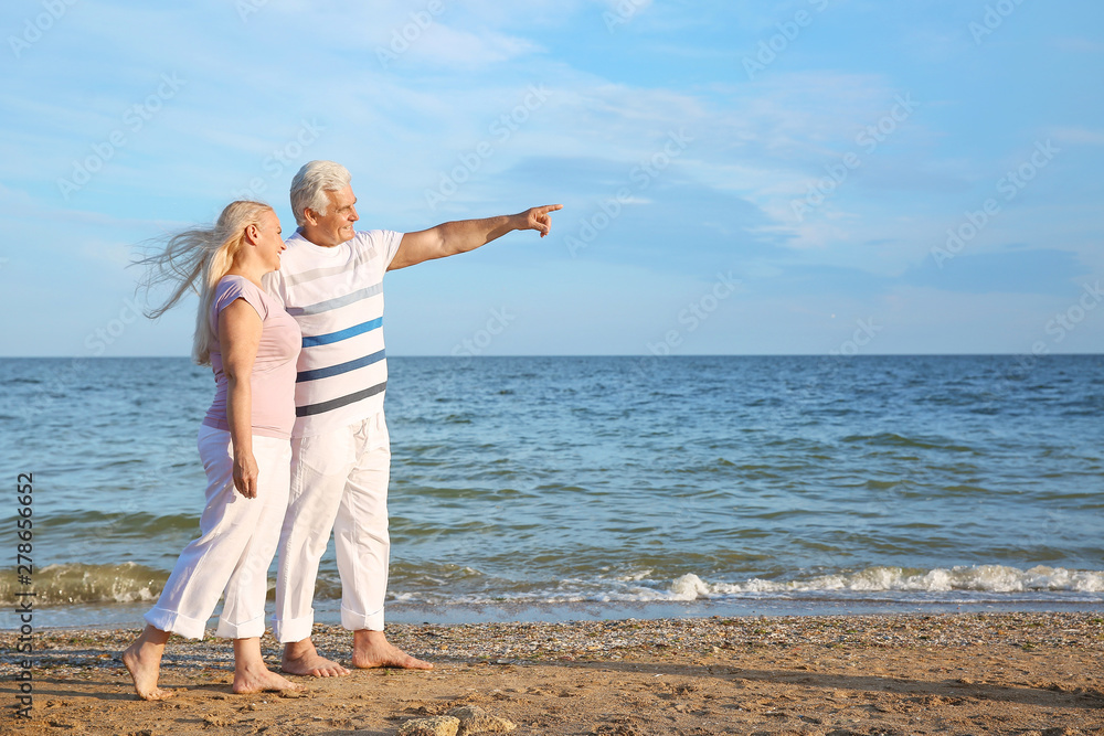Happy mature couple at sea resort
