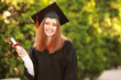 © Pixel-Shot - Happy young woman with diploma on graduation day