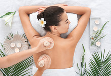 Beautiful Young Woman Receiving Massage In Spa Salon