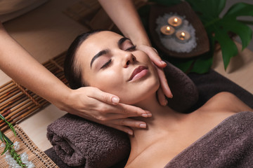 Wall Mural - Beautiful young woman receiving massage in spa salon