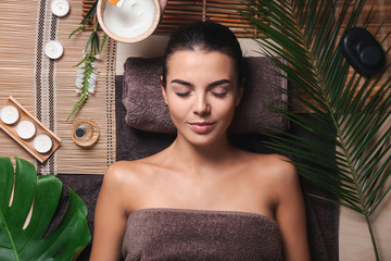 Canvas Print - Beautiful young woman relaxing in spa salon