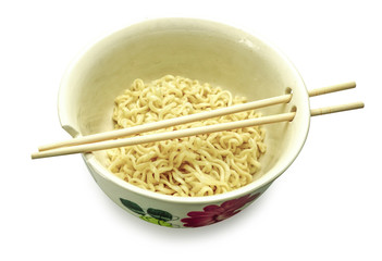 Instant noodle in bowl with chopsticks on white background.