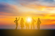 Silhouette of Happiness women team with sunset evening sky background
