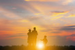 Silhouette of Grandfather grandmother and grandchild playing and walking evening sunset background, Happy family concept