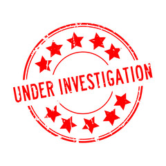 Sticker - Grunge red under investigation word with star icon rubber seal stamp on white background