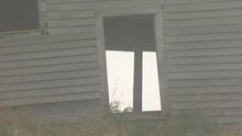 Eerie White Farm Door In Winter Time. Haunting And Haunted On A Densely Foggy Day.