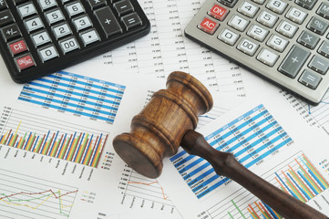 Arbitration concept, judge gavel and calculators on financial documents