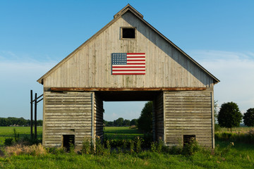 Wall Mural - Old wooden barn with American Flag