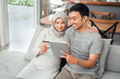 © Odua Images - asian muslim couple buy and do payment using credit card while online shopping on market place