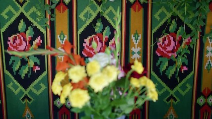 Wall Mural - Vase with yellow flowers at national carpet on wall