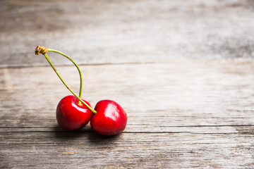 Ripe and juicy cherries on the dark rustic background. Selective focus. Shallow depth of field.