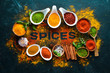 Indian spices on a black stone background. The word 