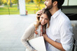 © NDABCREATIVITY - Cheerful happy couple using digital tablet outdoors