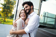 © NDABCREATIVITY - Happy young couple hugging and laughing outdoors