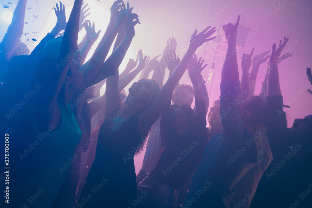 Close up photo of many birthday party people dancing clubbing purple lights confetti fog nightclub hands raised shiny formal-wear - obrazy, fototapety, plakaty 