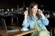 © Сергей Уланов - young girl drinking coffee and talking on the phone