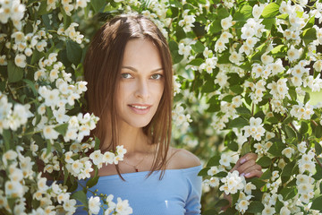 Poster - Pretty girl is smiling in the city park. Outdoors portrait