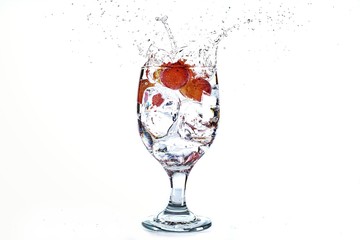 Grape drop in water glass