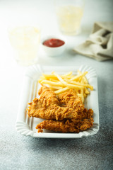 Wall Mural - Homemade fish and chips on white plate