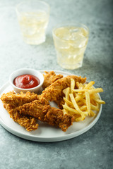 Wall Mural - Homemade fish and chips on white plate