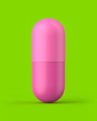 Pink pill capsule on a green background. 3d render. Front view. Kitsch Art Series.