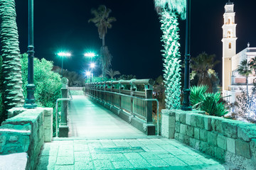 Wall Mural - The Wishing Bridge in the green light of a spotlight located on old city Yafo in Tel Aviv-Yafo in Israel