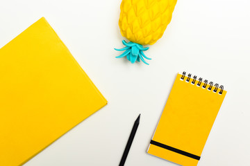 Top view image of office supplies or school accessories, trendy yellow colour objects shot from overhead