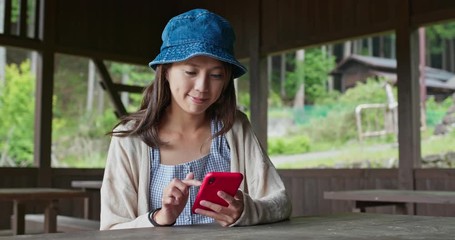 Canvas Print - Woman use of cellphone in the wooden house