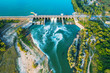 © DedMityay - Aerial panoramic view of concrete Dam at reservoir with flowing water, hydroelectricity power station, drone shot