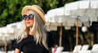 © Artem Markin - Portrait of a beautiful blonde in sunglasses, a modern girl travels around Thailand.