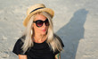 © Artem Markin - Portrait of a beautiful blonde in sunglasses, a modern girl travels around Thailand.