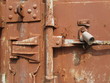 Lock on an old rusty iron door.