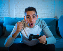 Close Up Portrait Of Young Man Having Fun Playing Video Games. In Leisure And Game Addiction Concept