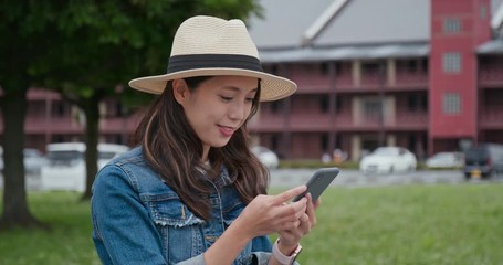 Wall Mural - Woman use of mobile phone in Yokohama Red Brick Warehouse