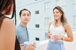 © DragonImages - Group of business people communicating with each other during coffee break outdoors