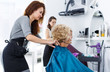 © JackF - Hairdresser seating female client in chair