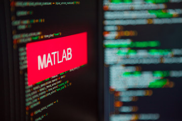 Wall Mural - programming language, matlab inscription on the background of computer code.