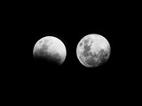 Fototapeta  - A partial lunar eclipse is now underway on 16 and 17 July 2019. The Moon should be covered about 65% by the Earth's umbral shadow at maximum eclipse