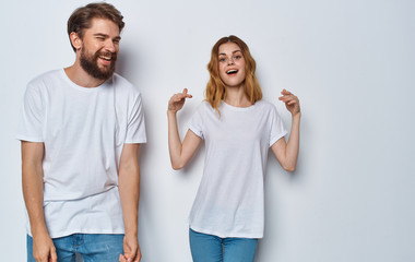 young couple in t-shirts studio