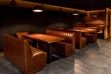 The interior of a nightclub, a pub in dark colors.