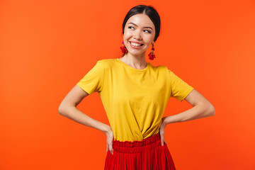 image of beautiful hispanic woman 20s dressed in skirt laughing at camera