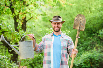 Sticker - happy earth day. Eco living. Eco farm. Harvest. sexy farmer hold shovel and watering can. farming and agriculture. Garden equipment. muscular ranch man in cowboy hat. Taking good care of plants