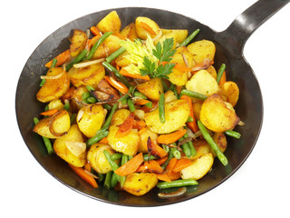 Wall Mural - Classic Roasted Potatoes in a Pan with Vegetables