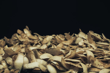 Poster - Potato skins on a black background. Close up.