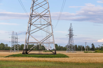 Group silhouette of transmission towers power tower, electricity pylon, steel lattice tower . Texture high voltage pillar, overhead power line.