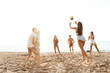 © Drobot Dean - Group of cheerful friends playing volleyball
