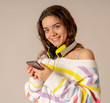 © SB Arts Media - Pretty young teenager girl in headphones listening to music and