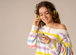 © SB Arts Media - Pretty young teenager girl in headphones listening to music and