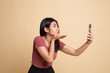 © halfbottle - Young Asian woman with mobile phone.