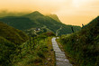 Storybook-like pathway through a misty mountain landscape in Taiwan's Yilan County